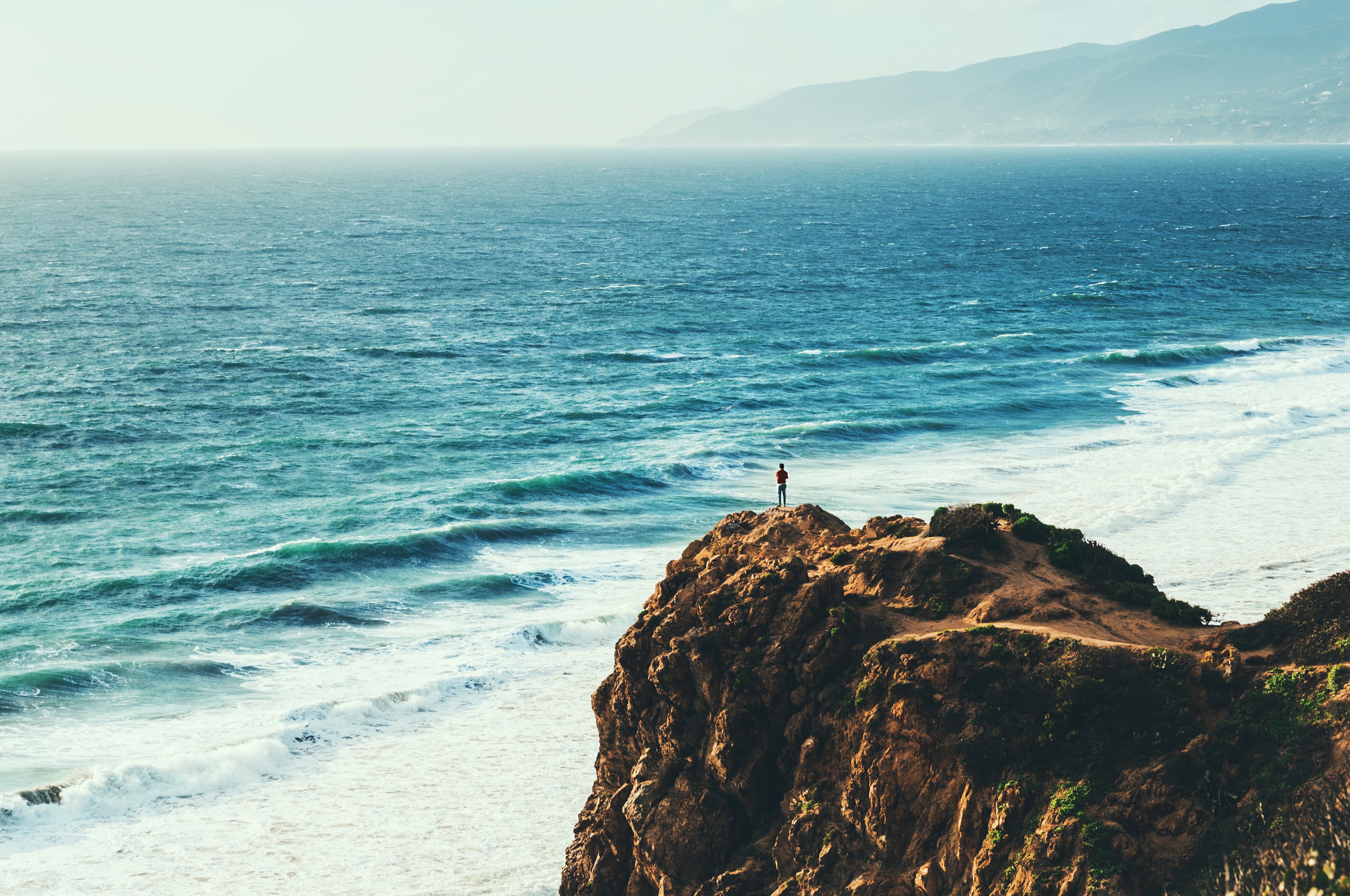 Point Dume cliffs, Malibu mountains, and the Pacific Ocean at sunset